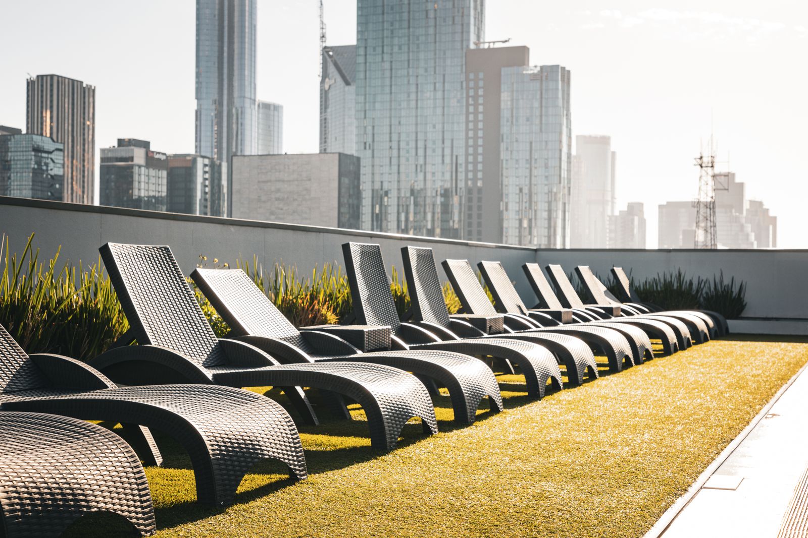Rooftop sky clubhouse deck with skyline views — representative image, not of this project